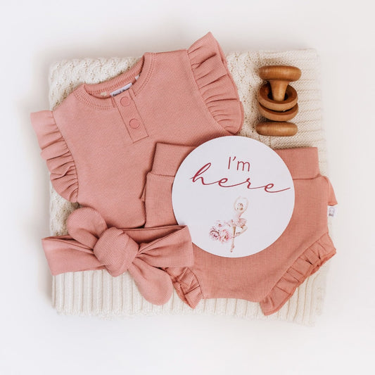 Snuggle Hunny organic bodysuits are made for babies and toddlers and our exclusive Rose Cotton rib is beautiful and perfect for baby girls. This bodysuit is short-sleeved, perfect for warmer weather, and under layers.