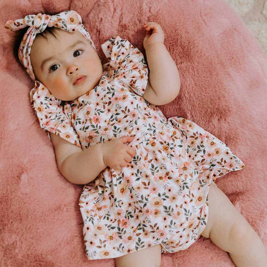 Snuggle Hunny organic dresses have arrived! We are so excited to launch our beautiful dresses in sizes up to 2. This short-sleeve dress features our exclusive Spring Floral print which is perfect for that summer day or birthday party. Soft and stretchy, they are easy-care and very comfy for bub. 