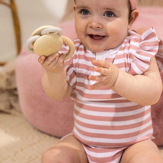 Snuggle Hunny organic bodysuits are made for babies and toddlers and our exclusive Rose & Milk Stripe is beautiful and perfect for baby girls. This bodysuit is short-sleeved, perfect for warmer weather, and under layers.